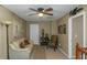 Well-lit office space with ceiling fan, desk, chair, and a view of an 'office' sign at 1104 Stepping Stone Ln, Conyers, GA 30012