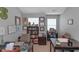 Home office with a desk, shelving, décor, and two windows for ample light at 1104 Stepping Stone Ln, Conyers, GA 30012