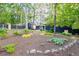 Large backyard featuring lush landscaping, a dark privacy fence and shed at 2382 Whites Mill Ln, Decatur, GA 30032