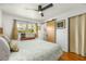 Cozy bedroom with hardwood floors and a sliding closet door at 2382 Whites Mill Ln, Decatur, GA 30032