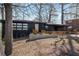 Modern home with dark exterior, stone accents, and natural wood porch and railing at 2382 Whites Mill Ln, Decatur, GA 30032