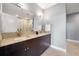 Bathroom featuring double vanity with granite countertop, undermount sinks, and tiled shower enclosure at 905 Ju Ne Street Ne St, Atlanta, GA 30309
