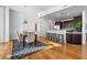 Dining area featuring modern lighting, a textured wall, and seamless flow to the kitchen at 905 Ju Ne Street Ne St, Atlanta, GA 30309