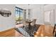 Dining area showcasing a modern chandelier, decorative wall, and large windows with cityscape views at 905 Ju Ne Street Ne St, Atlanta, GA 30309