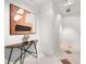 Hallway featuring a console table with a sculpture and an abstract painting on the wall at 905 Ju Ne Street Ne St, Atlanta, GA 30309