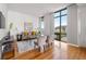 Elegant living room with hardwood floors, a large window with views, and stylish decor, creating an inviting atmosphere at 905 Ju Ne Street Ne St, Atlanta, GA 30309