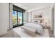 Serene bedroom with plush carpeting, large windows with city views, and a calming neutral color palette at 905 Ju Ne Street Ne St, Atlanta, GA 30309