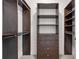 Spacious walk-in closet with custom built-in shelving and ample storage space for organization at 905 Ju Ne Street Ne St, Atlanta, GA 30309