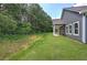 A spacious backyard featuring a well-maintained lawn and an inviting outdoor patio area at 109 Sunflower Ne Cir, Cartersville, GA 30121