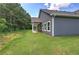 Backyard of home with lush green grass, gray siding, and covered porch at 109 Sunflower Ne Cir, Cartersville, GA 30121