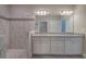 Bathroom featuring double sink vanity, large mirror, and luxurious walk-in shower at 109 Sunflower Ne Cir, Cartersville, GA 30121