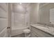 Well-lit bathroom featuring a granite vanity and shower-tub combination at 109 Sunflower Ne Cir, Cartersville, GA 30121
