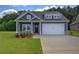 Charming home featuring a two-car garage and welcoming front porch at 109 Sunflower Ne Cir, Cartersville, GA 30121