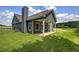 Exterior of a home with gray siding, a covered porch, and a well-manicured lawn at 109 Sunflower Ne Cir, Cartersville, GA 30121
