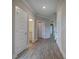 Hallway with wood-look flooring and doors leading to various rooms at 109 Sunflower Ne Cir, Cartersville, GA 30121