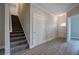Entry hall with staircase, door to outside, and wood-look floors at 109 Sunflower Ne Cir, Cartersville, GA 30121