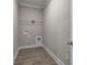 Empty laundry room with wood-look floors and white trim at 109 Sunflower Ne Cir, Cartersville, GA 30121