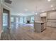 Spacious living room featuring a fireplace, modern ceiling fan, lots of natural light and grey wood floors at 109 Sunflower Ne Cir, Cartersville, GA 30121