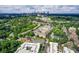 Overhead view of a residential complex surrounded by lush greenery with a scenic cityscape backdrop at 1418 Dresden Ne Dr # 385, Brookhaven, GA 30319