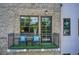 Cozy balcony with outdoor seating, artificial turf, and views of the surrounding landscape through large windows at 1418 Dresden Ne Dr # 385, Brookhaven, GA 30319