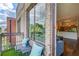 Balcony with outdoor seating overlooking the neighborhood, with a glimpse into the home's kitchen and living area at 1418 Dresden Ne Dr # 385, Brookhaven, GA 30319