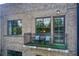 A balcony with wrought iron railing and two chairs facing outside at 1418 Dresden Ne Dr # 385, Brookhaven, GA 30319