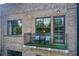 Charming balcony featuring seating, artificial turf, and views of the surrounding brick facade and greenery at 1418 Dresden Ne Dr # 385, Brookhaven, GA 30319