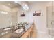 Bathroom with granite countertops, a double sink, a walk-in shower with glass doors, and modern fixtures at 1418 Dresden Ne Dr # 385, Brookhaven, GA 30319