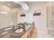 Modern bathroom with double vanity, sleek mirrors, and a glass-enclosed shower area with tiled walls at 1418 Dresden Ne Dr # 385, Brookhaven, GA 30319