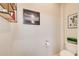 Small half-bath featuring art on the wall with dark colored wood accents at 1418 Dresden Ne Dr # 385, Brookhaven, GA 30319