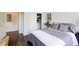 Bedroom with hardwood floors and closet with clothes in view at 1418 Dresden Ne Dr # 385, Brookhaven, GA 30319