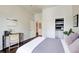 Bright bedroom featuring a closet, wood floors and a queen bed at 1418 Dresden Ne Dr # 385, Brookhaven, GA 30319