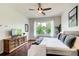 Well-lit bedroom features a wooden dresser and a view of the outdoors at 1418 Dresden Ne Dr # 385, Brookhaven, GA 30319