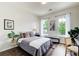 Cozy bedroom with hardwood floors, natural light from two windows and soft, neutral colors at 1418 Dresden Ne Dr # 385, Brookhaven, GA 30319
