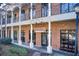 Elegant brick building exterior with covered walkway, showcasing architectural details and inviting entrance at 1418 Dresden Ne Dr # 385, Brookhaven, GA 30319