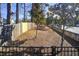 A fenced yard area with wood mulch, providing a safe and attractive outdoor space for residents at 1418 Dresden Ne Dr # 385, Brookhaven, GA 30319