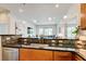 Stylish kitchen showcasing granite counters, stainless steel appliances, and an open layout overlooking the living space at 1418 Dresden Ne Dr # 385, Brookhaven, GA 30319