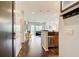 Open-concept layout features sleek wood floors, modern lighting, and views of the living room with access to a balcony at 1418 Dresden Ne Dr # 385, Brookhaven, GA 30319