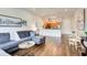 Comfortable living room featuring a modern sectional sofa and an open floor plan with hardwood floors at 1418 Dresden Ne Dr # 385, Brookhaven, GA 30319