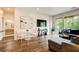 Bright living room featuring hardwood floors, modern decor, and a sliding door to the outside at 1418 Dresden Ne Dr # 385, Brookhaven, GA 30319