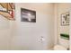 Bright powder room with wall art and modern fixtures at 1418 Dresden Ne Dr # 385, Brookhaven, GA 30319