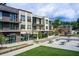 New modern retail space with outdoor seating, large storefront windows, and lush green lawn at 1418 Dresden Ne Dr # 385, Brookhaven, GA 30319