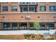 Modern retail location in brick building with tree and storefront windows at 1418 Dresden Ne Dr # 385, Brookhaven, GA 30319
