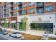 Modern retail spaces with storefront windows and street parking with electric car at 1418 Dresden Ne Dr # 385, Brookhaven, GA 30319