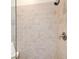 Close-up of a shower area showing neutral tiles, glass partition, and a modern shower head fixture at 1418 Dresden Ne Dr # 385, Brookhaven, GA 30319