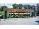 Retail storefront with awnings, signage, and well-maintained landscaping at 1418 Dresden Ne Dr # 385, Brookhaven, GA 30319
