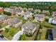 Beautiful aerial view of a suburban neighborhood with well-maintained homes and lush landscaping at 1520 Gallant Fox Ln, Suwanee, GA 30024