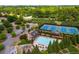 Aerial view of community amenities including pool, tennis courts, clubhouse, and playground at 1520 Gallant Fox Ln, Suwanee, GA 30024