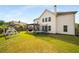 Spacious backyard features a pergola, play set, and trampoline, perfect for outdoor fun at 1520 Gallant Fox Ln, Suwanee, GA 30024