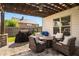 Backyard patio with stone pavers, outdoor furniture, pergola, and BBQ grill at 1520 Gallant Fox Ln, Suwanee, GA 30024